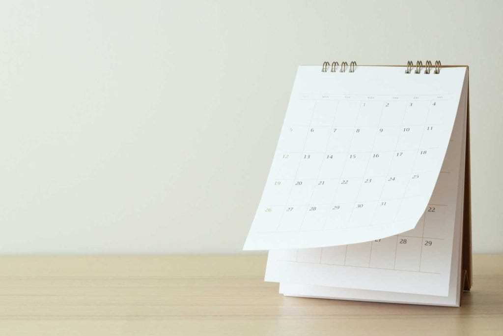 Monthly calendar sitting upright on a desk