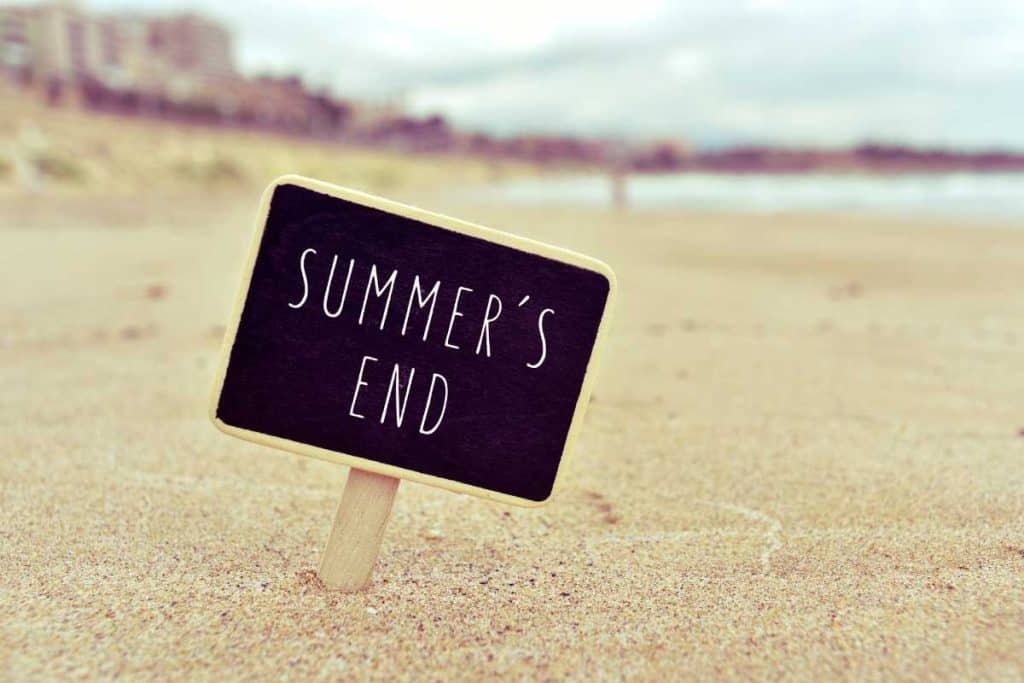 A Summer's End sign at the ocean
