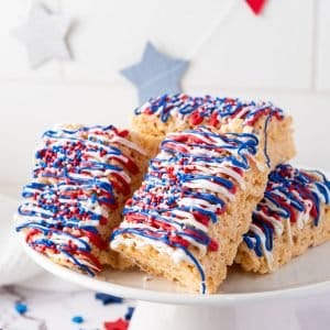 Rice Krispies Marshmallow treats with red, white and blue icing and sprinkles